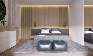 No quarto do casal com os mesmo tons de rocho e madeira adicionado com puff para apoio da cama em tons pratas que dá um pouco de sofisticação.