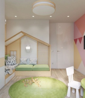 Quarto lúdico com inspiração montessoriano, tem parede coloridas em padrões geométricos, cama conjugada com sofá que é um armário para guardar brinquedos, num ambiente que imita o design de casinha de boneca.