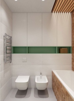 Mobiliário planejado branco para melhor aproveitamento do espaço e armazenamento, com nicho verde.