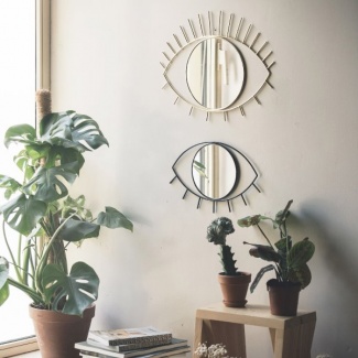 espelho de ferro em formato de olhos