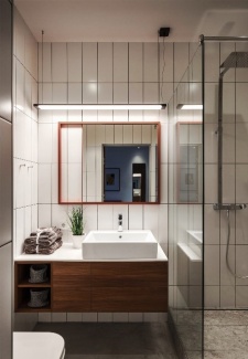 Apartamento Industrial - A luminária pendente distribui a luz uniformemente ao longo do comprimento da área da pia. 