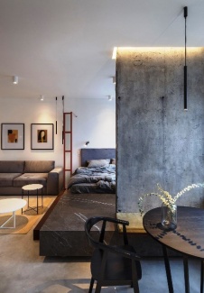 Apartamento Industrial - A luminária pendente da mesa é a mesma usada sobre o sofá criando uma noção de continuidade 